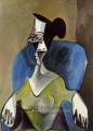Femme assise dans un fauteuil bleu 1962 Kubismus